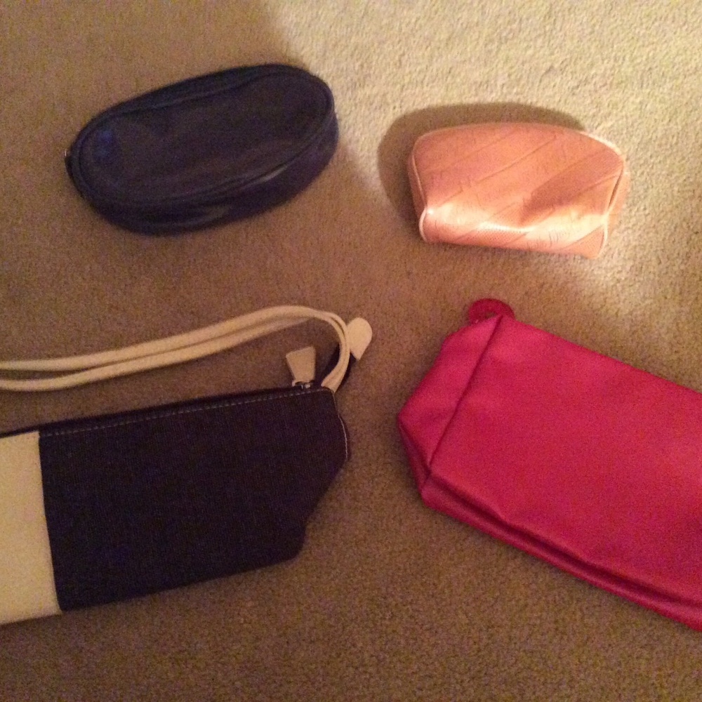 Four Small Gift Cosmetic Bags one from Clinique, two from Estée Lauder and Saks